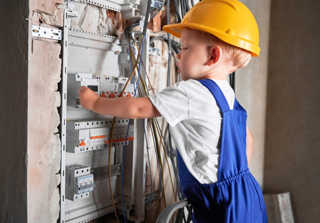 little boy repairing electrical control panel at h 2023 11 27 05 33 23 utc